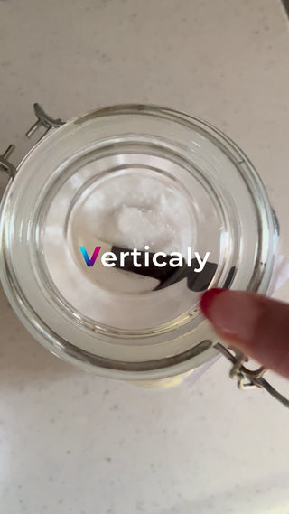 white bottle and black spoon