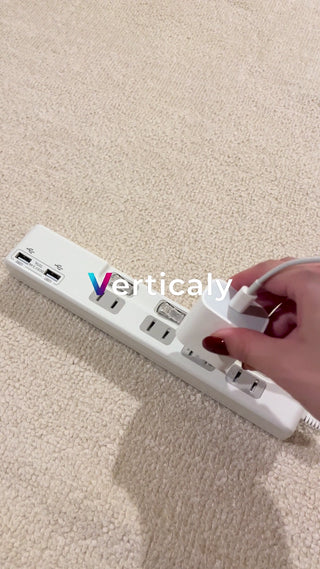 Insert the charger into the power strip