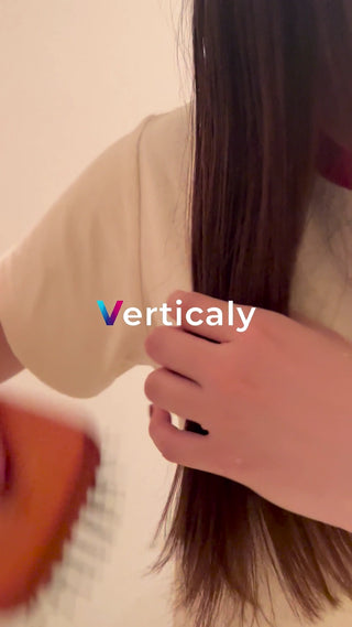 Woman touching her hair at sunset