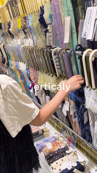 A woman&#39;s hand choosing an umbrella