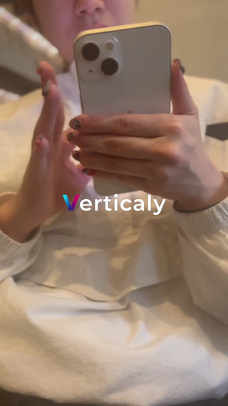 A woman holding a smartphone vertically