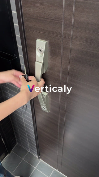 A woman operating the front door key