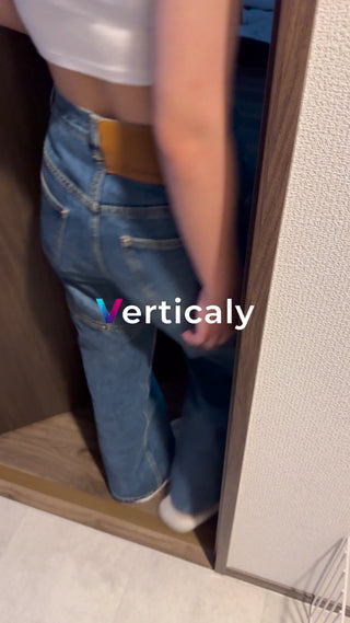 A woman in denim walking through the city