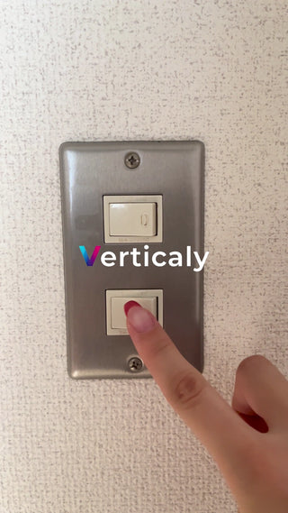 Finger pressing the switch, red nail