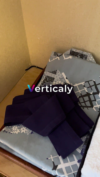 A dark blue obi placed on the tatami