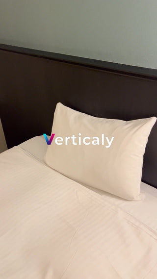 white bed, pillows and sheets