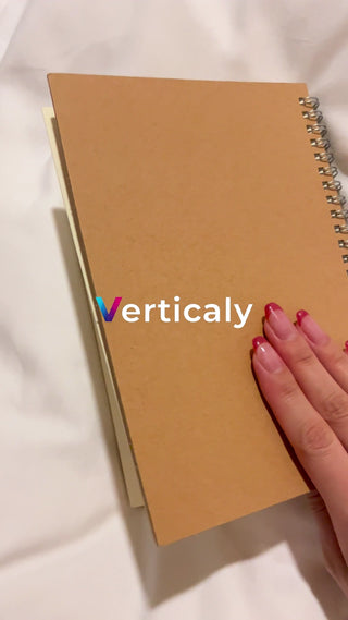 A notebook and hands, spring sunlight