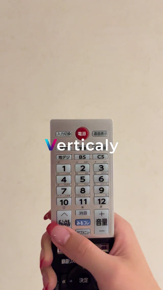 Hand holding the remote control