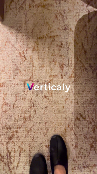 Black leather shoes sitting on the floor