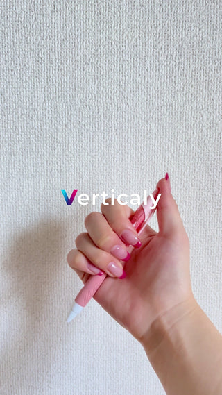 Hand holding a pink pen